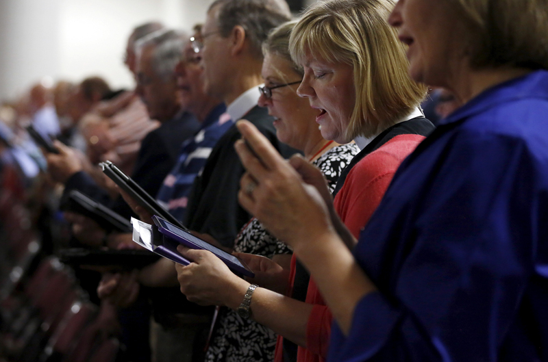 Members sing during a church service during the General Convention of the Episcopal Church in Salt Lake City
